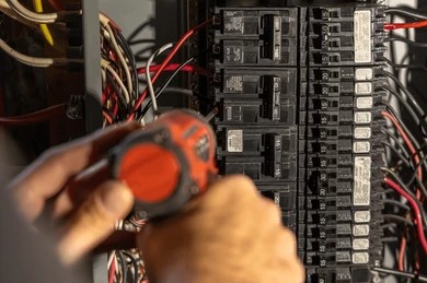 electrician-installing-electrical-circuit-breaker-2602528220809